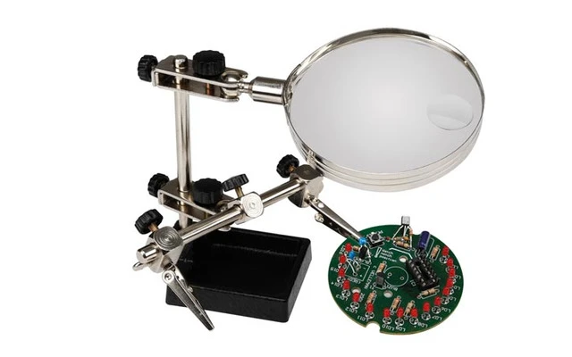 Soporte para circuitos impresos con lupa