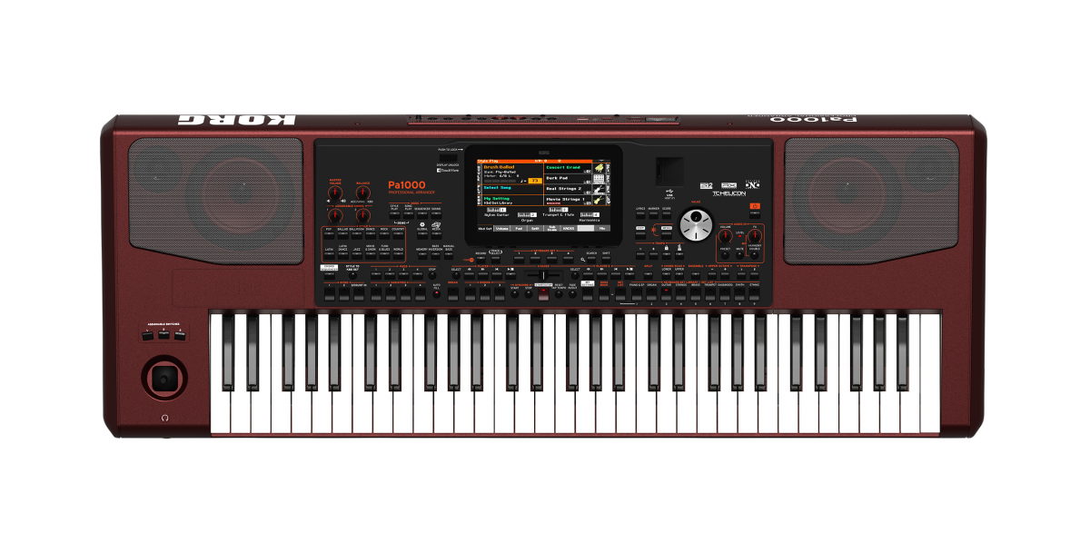Korg Pa1000 visto de cima, com o ecrã tátil, os botões de estilos e sons e o joystick